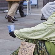 Photo of a homeless person panhandling