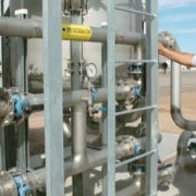 Assistant plant superintendent Jose Rios checks the biogas conditioning system.