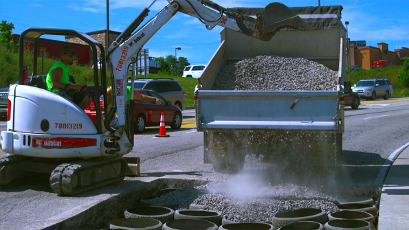 Chuckhole repair system uses waste tires to stabilize road base (with related video)