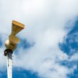 Old mechanical civil defense siren, also known as air-raid siren or tornado siren