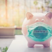 piggy bank wearing covid-19 mask