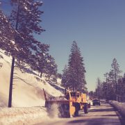 snowplow clearing a road in winter