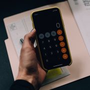 Person holding a calculator